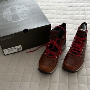 Timberland Men's Flyroam Trail Mid Leather boot in brown with red laces